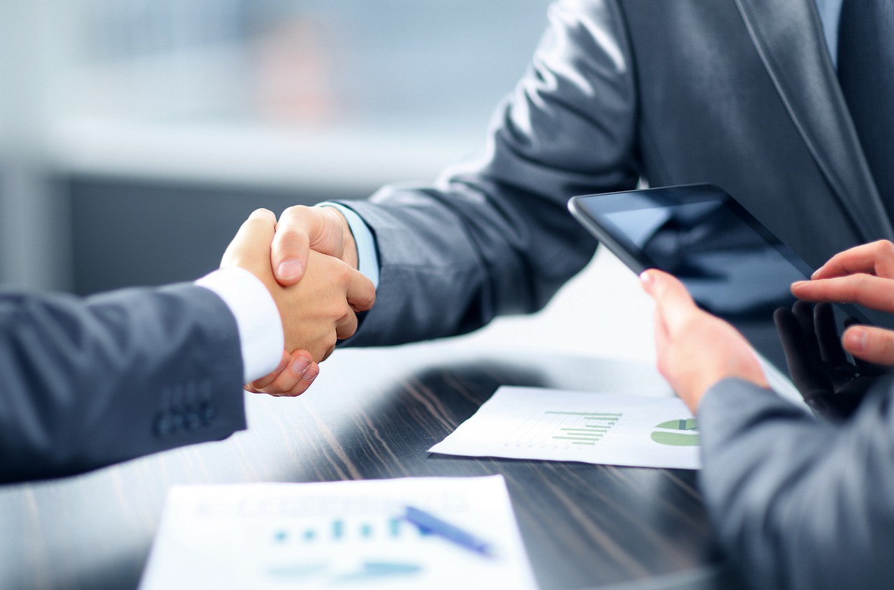 Financial advisor discussing an advanced loan and investment plan with clients